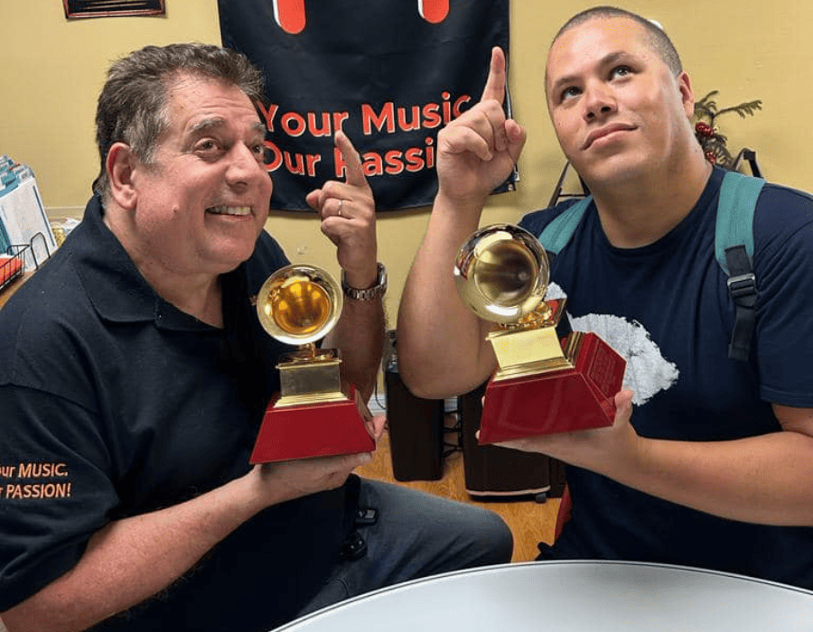 Lannie and Jose Lannie and Jose holding Grammys